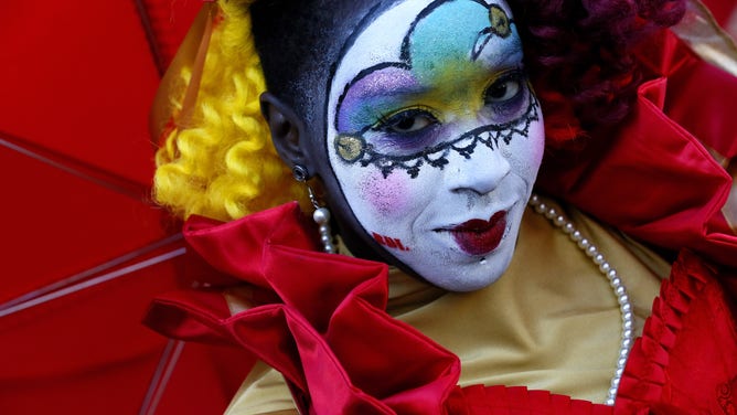 A reveler makes her way through the French Quarter during Mardi Gras day on February 9, 2016 in New Orleans.