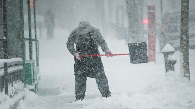 FILE - Shoveling snow is hard work especially if your body is not in shape.