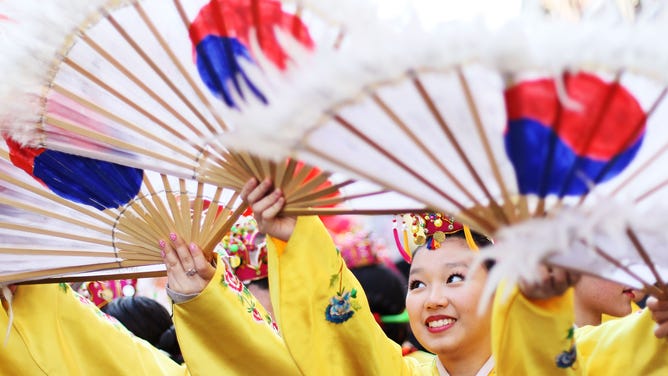 Korean dancers warm up before the start of the Chinatown Lunar New Year Parade in New York City in 2010, the last year of the tiger.