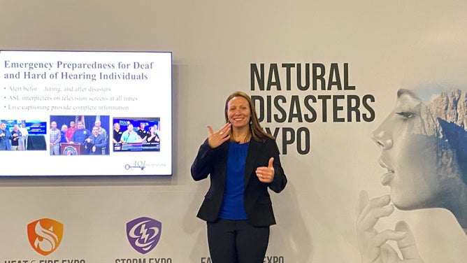 Jenny Locy, with AQUI Services, at the Natural Disaster Expo in Miami Beach on Feb. 8, 2022.