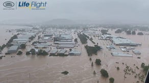 Families huddled on rooftops to escape Australian flooding