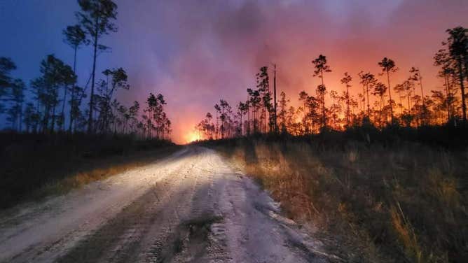 Smoke and flames from the Adkins Avenue Fire in the Florida Panhandle on Monday, March 7, 2022.