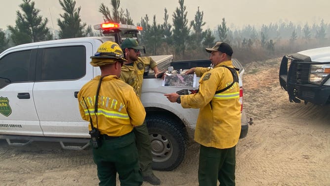 Florida Forest Service wildland firefighters on Tuesday, March 8, 2022 near the Chipola Complex Fires.