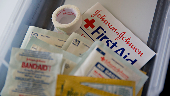 Johnson & Johnson first aid products are arranged for a photograph in Tiskilwa, Illinois, U.S., on Thursday, July 2, 2015.