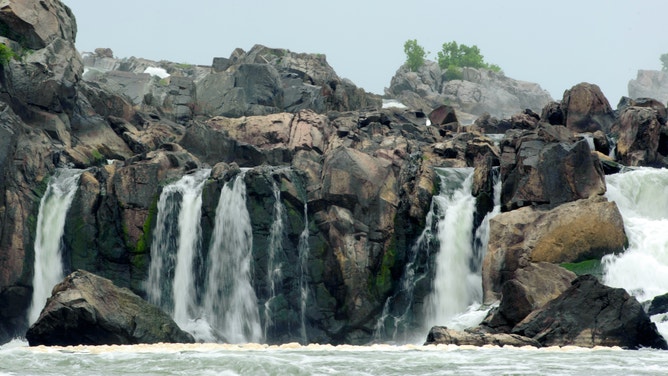 Water carves through rock as flows through the Potomac Gorge.