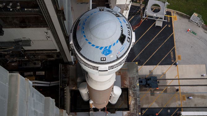 FILE PHOTO: In this NASA handout, A United Launch Alliance Atlas V rocket with Boeings CST-100 Starliner spacecraft aboard is seen as it is rolled out of the Vertical Integration Facility to the launch pad at Space Launch Complex 41 ahead of the Orbital Flight Test-2 (OFT-2) mission, Monday, Aug. 2, 2021 at Cape Canaveral Space Force Station in Florida. Boeings Orbital Flight Test-2 will be Starliners second uncrewed flight test and will dock to the International Space Station as part of NASA's Commercial Crew Program. The mission, currently targeted for launch at 1:20 p.m. EDT Tuesday, Aug. 3, will serve as an end-to-end test of the system's capabilities. Photo Credit: (NASA/Aubrey Gemignani) (Photo by /NASA via Getty Images)