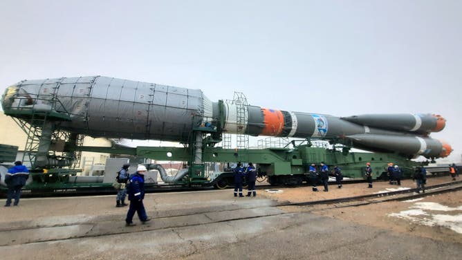 A Soyuz-2.1b rocket booster with a Fregat upper stage carrying British OneWeb satellites is being transported from an assembling facility to a launch pad at the Baikonur Cosmodrome. The launch is scheduled for 5 March 2022 at 01:41 Moscow time.