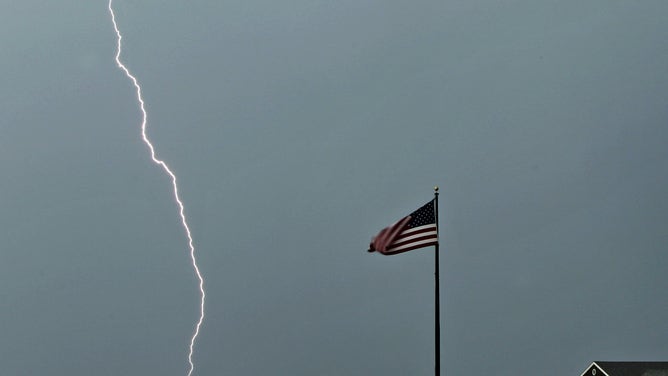 Lightning strikes in the distance.