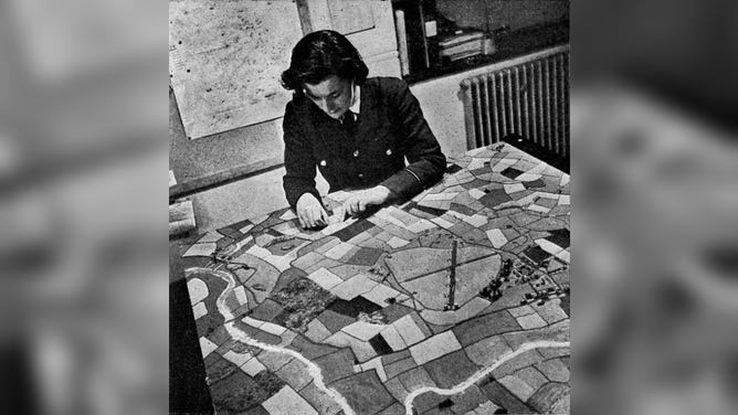 The Women's Auxiliary Air Force, working on a pictorial map at a Bomber Station during World War II.