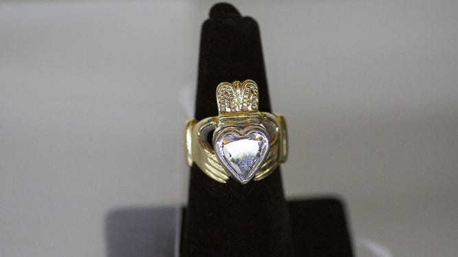 A claddagh ring on display.