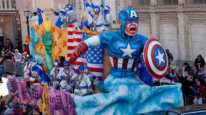 A float depicting Captain America rides down the street during Mardi Gras in Mobile.