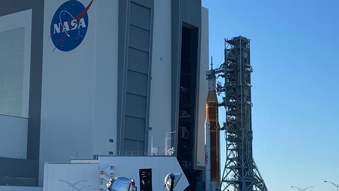 Artemis-1, the Space Launch System and Orion, emerge from the VAB at Kennedy Space Center, Florida.