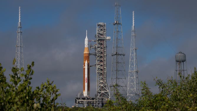 NASA’s Space Launch System (SLS) rocket with the Orion spacecraft aboard is seen atop a mobile launcher at Launch Complex 39B, Friday, March 18, 2022, after being rolled out to the launch pad for the first time at NASA’s Kennedy Space Center in Florida. Ahead of NASA’s Artemis I flight test, the fully stacked and integrated SLS rocket and Orion spacecraft will undergo a wet dress rehearsal at Launch Complex 39B to verify systems and practice countdown procedures for the first launch. Photo Credit: (NASA/Aubrey Gemignani)