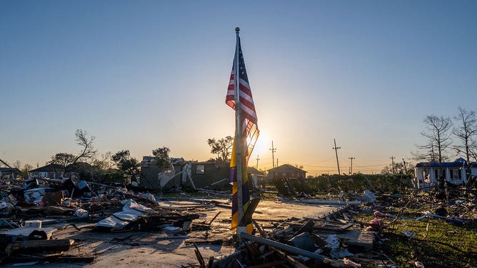 Flag in tornado debris in Arabi, Louisiana 3-24-2022
