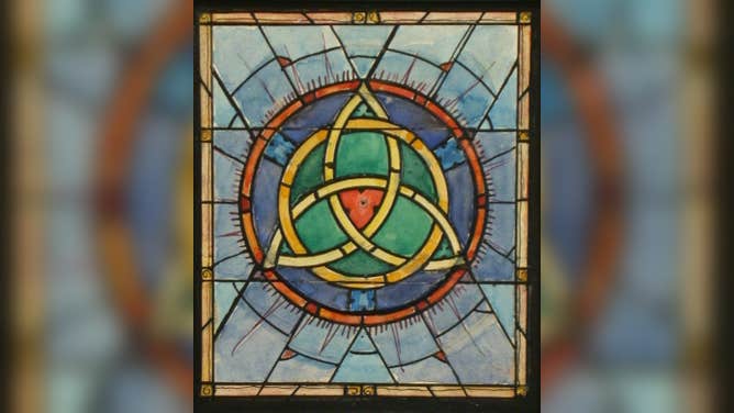 A design drawing for a stained glass window with a Celtic trefoil knot.