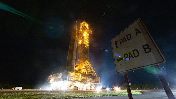 NASA’s Space Launch System (SLS) rocket with the Orion spacecraft aboard is seen atop a mobile launcher as it rolls back to the Vehicle Assembly Building, Tuesday, April 26, 2022, at NASA’s Kennedy Space Center in Florida. Once inside the Vehicle Assembly Building, teams will work on replacing a faulty upper stage check valve and a small leak within the tail service mast umbilical ground plate housing on the mobile launcher while the supplier for the gaseous nitrogen makes upgrades to their pipeline configuration to support Artemis I testing and launch. Following completion, teams will return to the launch pad to complete the next wet dress rehearsal attempt. Photo Credit: (NASA/Aubrey Gemignani)