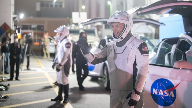 NASA astronaut Kjell Lindgren waves to family and friends as he and crew mates, NASA astronauts Robert Hines, Jessica Watkins, and ESA (European Space Agency) astronaut Samantha Cristoforetti, wearing SpaceX spacesuits, depart the Neil A. Armstrong Operations and Checkout Building for Launch Complex 39A to board the SpaceX Crew Dragon spacecraft for the Crew-4 mission launch, Tuesday, April 26, 2022, at NASA’s Kennedy Space Center in Florida. NASA’s SpaceX Crew-4 mission is the fourth crew rotation mission of the SpaceX Crew Dragon spacecraft and Falcon 9 rocket to the International Space Station as part of the agency’s Commercial Crew Program. Lindgren, Hines, Watkins, and Cristoforetti are scheduled to launch at 3:52 a.m. ET on April 27, from Launch Complex 39A at the Kennedy Space Center. Photo Credit: (NASA/Aubrey Gemignani)