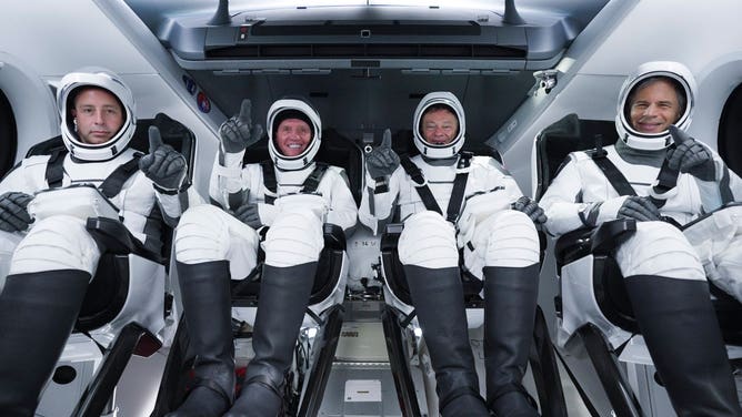 The Axiom-1 crew from left to right inside the Dragon spacecraft: Canadian Mark Pathy, American Larry Connor, Axiom Space vice president and former NASA astronaut Michael López-Alegría and Israeli Eytan Stibbe