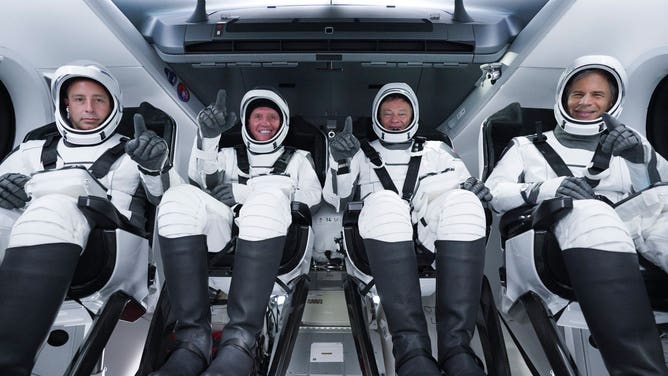 The Axiom-1 crew from left to right inside the Dragon spacecraft: Canadian Mark Pathy, American Larry Connor, Axiom Space vice president and former NASA astronaut Michael López-Alegría and Israeli Eytan Stibbe