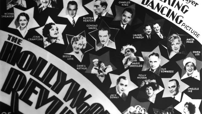 In the summer before the 1929 stock market crash, the Hollywood Revue of 1929 premiered. In this poster, "Singin' in the Rain" singer/actor Cliff Edwards is pictured in a far right star under his stage name Ukelele Ike.