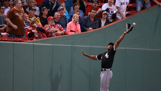 Chicago White Sox left fielder Eloy Jimenez misses the catch on a wind blown fly ball at Fenway Park in Boston on June 25, 2019.