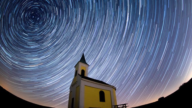 Startrails are seen during the Lyrids meteor shower over Michaelskapelle on April 21, 2020 in Niederhollabrunn, Austria. (EDITORS NOTE: Multiple exposures were combined to produce this image.)