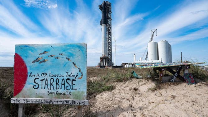 SpaceX's first orbital Starship SN20 is stacked atop its massive Super Heavy Booster 4 at the company's Starbase facility near Boca Chica Village in South Texas on February 10, 2022. 