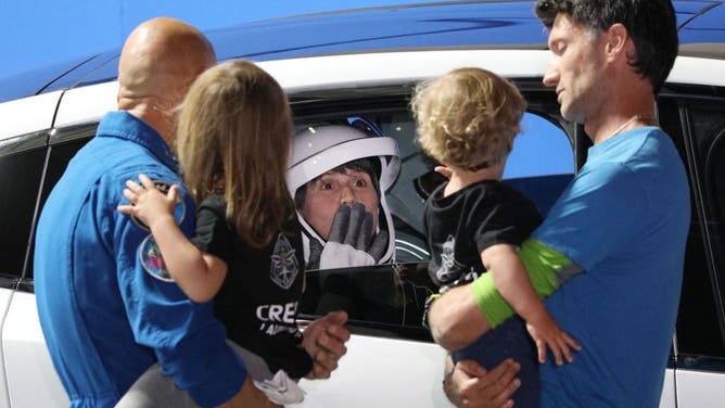 Astronaut Samantha Cristoforetti of the European Space Agency blows a kiss to family members during the Crew-4 walk out at the Neil A. Armstrong Operations and Checkout Building en route to launch complex 39A at the Kennedy Space Center in Florida on April 27, 2022. - The rocket will ferry the Crew Dragon spacecraft with NASA astronauts Hines, Kjell Lindgren, Watkins, and Samantha Cristoforetti of the European Space Agency to the International Space Station. Their flight is the fourth crewed operational mission of a Crew Dragon spacecraft and the seventh overall crewed orbital flight since the United States resumed crewed space flight in May of 2020. (Photo by Gregg Newton / AFP) (Photo by GREGG NEWTON/AFP via Getty Images)