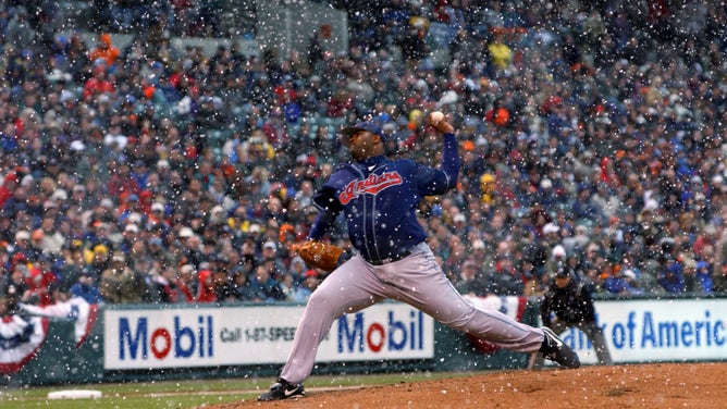 C.C. Sabathia #52 of the Cleveland Indians delivers a pitch against the Baltimore Orioles before a 13 minute snow delay was called on opening day at Oriole Park at Camden Yards on March 31, 2003 in Baltimore, Maryland.