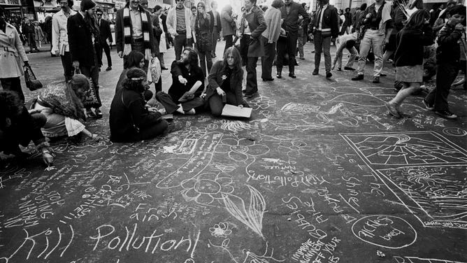 Messages are scrawled onto the streets of New York City on Earth Day 1970.