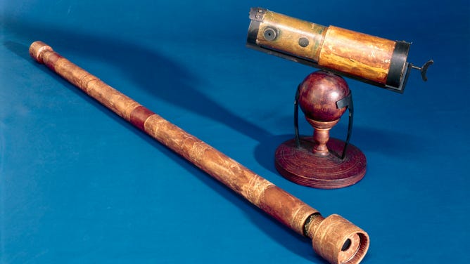 Replicas, made in 1923 and 1924, are of telescopes invented by Galileo in ca. 1609 (on right) and Sir Isaac Newton in 1668 (on left). 