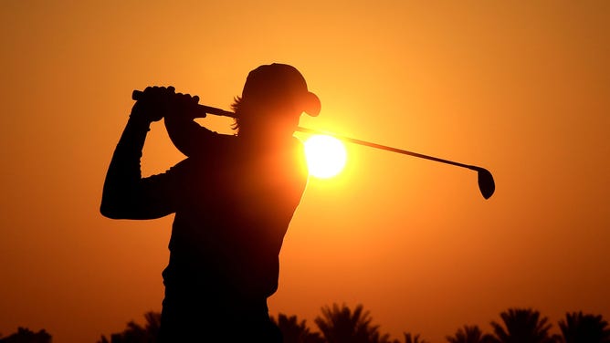 Camilo Villegas of Colombia warms up on the driving range against the rising desert sun before he started his second round of The Abu Dhabi Golf Championship at Abu Dhabi Golf Club on January 22, 2010 in Abu Dhabi, United Arab Emirates. 