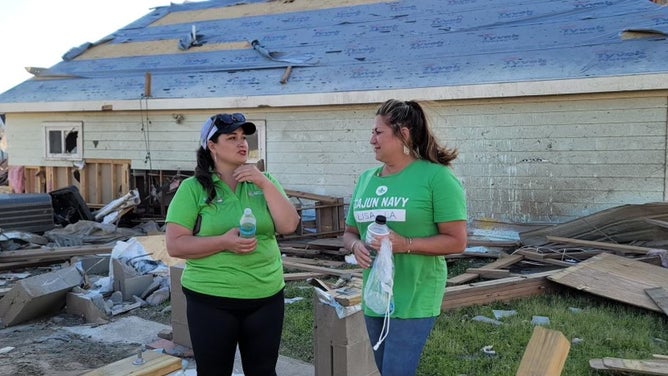 Cajun Navy Operations Director Stacy Parker (left) responding to tornado recovery efforts. (Image credit: Cajun Navy)