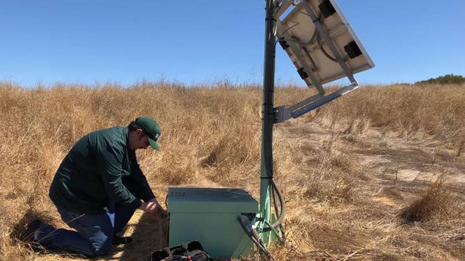 A USGS electronics technician performs maintenance on a ShakeAlert Earthquake Early Warning (EEW) sensor station, located in the San Francisco Bay Area.