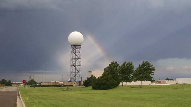 A rainbow beams next to the radome at NEXRAD ROC in Norman, Oklahoma.