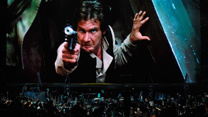 LAS VEGAS - MAY 29: Actor Harrison Ford's Han Solo character from "Star Wars Episode VI: Return of the Jedi" is shown on screen while musicians perform during "Star Wars: In Concert" at the Orleans Arena May 29, 2010 in Las Vegas, Nevada. 