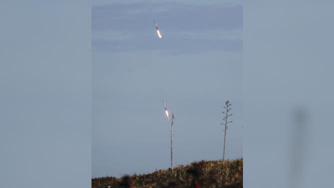 Two of the boosters are seen as they land at Cape Canaveral Air Force Station after the launch of SpaceX Falcon Heavy rocket from launch pad 39A at NASA’s Kennedy Space Center on April 11, 2019 in Titusville, Florida. The rocket is carrying a communications satellite built by Lockheed Martin into orbit. (Photo by Joe Raedle/Getty Images)