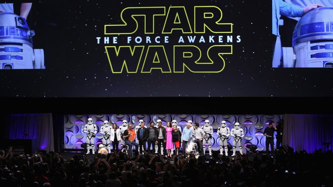 ANAHEIM, CA - APRIL 16: (L-R) Producer Kathleen Kennedy, actors Peter Mayhew, Mark Hamill, Oscar Isaac, John Boyega, Daisy Ridley, Carrie Fisher, Anthony Daniels, director J.J. Abrams and moderator Anthony Breznican speak onstage during Star Wars Celebration 2015 on April 16, 2015 in Anaheim, California. 