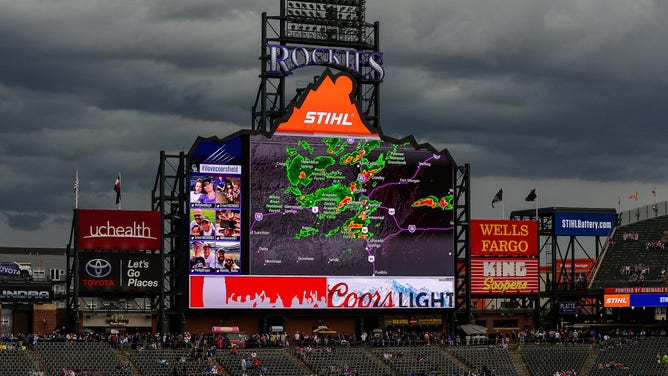 The outfield scoreboard at Coors Field displays a view of the weather radar during a delay before a scheduled game between the Colorado Rockies and the Miami Marlins on June 24, 2018 in Denver, Colorado.