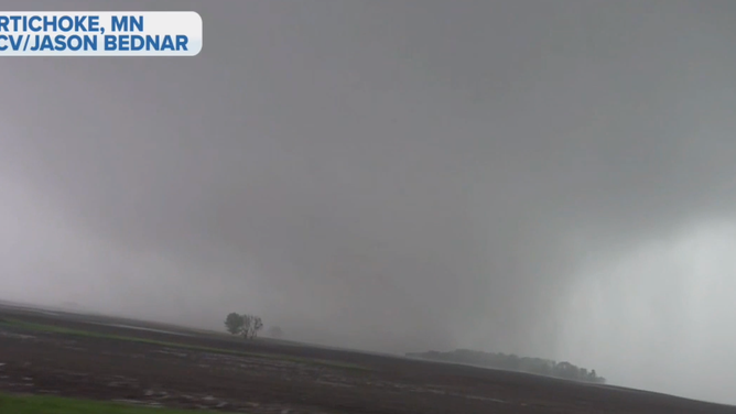 A screenshot of video by Jason Bednar showing a potentially rain-wrapped tornado in Artichoke, Minn. on Monday, May 30, 2022.