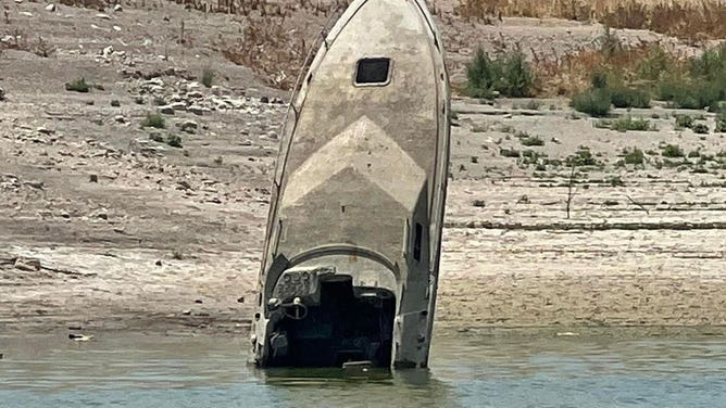 ‘It’s a different lake every time’: Sunken boats emerge from dwindling ...