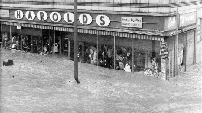 Floodwaters were seen rushing down a street in Elmira, New York, as the remnants of Hurricane Agnes dumped torrential rainfall across the region in June 1972.