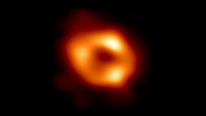 This is the first image of Sagittarius A*, the supermassive black hole at the centre of our galaxy. It was captured by the Event Horizon Telescope (EHT), an array which linked together eight existing radio observatories across the planet to form a single "Earth-sized" virtual telescope. (Credit: EHT Collaboration)