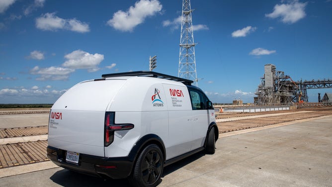 Prototypes of the crew transportation vehicle (CTV) for Artemis crewed missions are driven out to Launch Complex 39B at NASA’s Kennedy Space Center in Florida on May 11, 2022. Canoo Technologies Inc., was awarded a contract to design and provide the next generation of CTVs for the Artemis crewed missions. (Photo credit: NASA/Kim Shiflett)