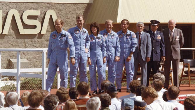 The STS-7 crew included (from left) mission specialists Norman Thagard, John Fabian, and Sally Ride; pilot Frederick Hauck; and commander Robert Crippen. Behind Crippen is John Manke, director of NASA's Dryden Flight Research Center at the time. (Image: NASA)