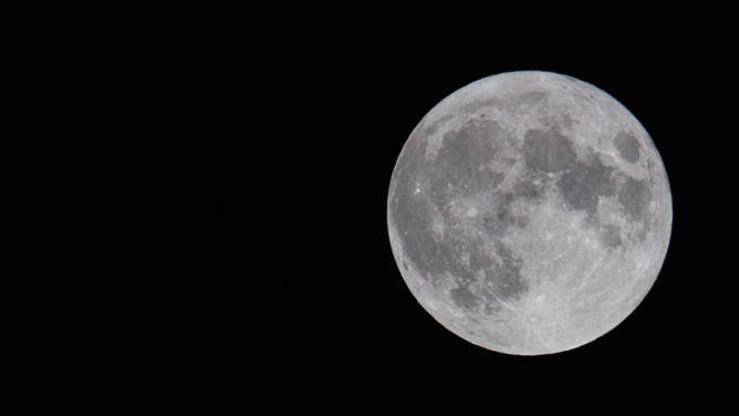 The first full moon of summer 2021, also known as the Strawberry Moon, the last supermoon of 2021 as seen in the Greek sky in Thessaloniki, Greece on June 24, 2021. (Photo by Nicolas Economou/NurPhoto via Getty Images)