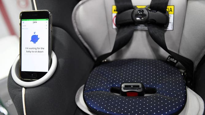 The Tata Pad by Filo, a smart baby car seat alarm to alert when a child is left in a vehicle, is displayed during the Consumer Electronics Show (CES) on January 6, 2022 in Las Vegas, Nevada. (Photo by PATRICK T. FALLON/AFP via Getty Images)