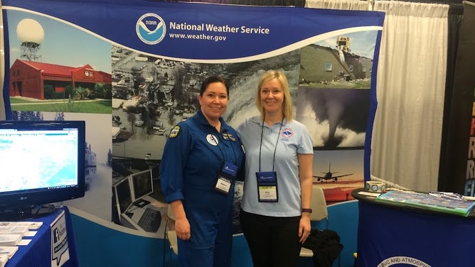 Waddington representing the National Weather Service at a conference.