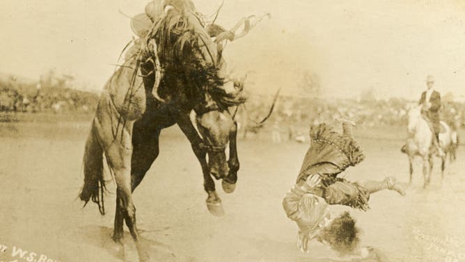 Bonnie McCarol is thrown from her horse. Cheyenne, Wyoming circa 1919.