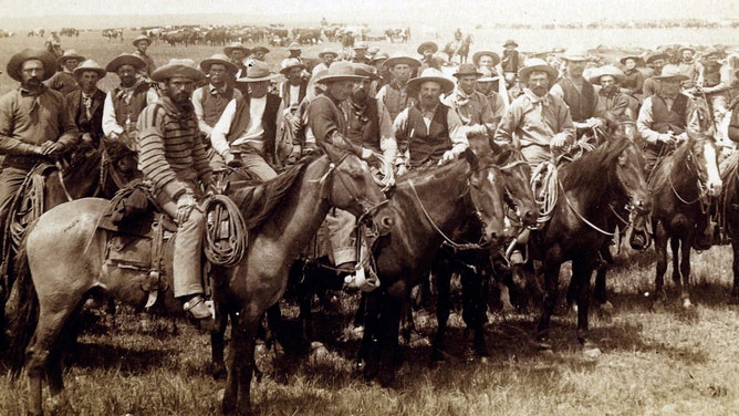Cowboys on horseback in Wyoming in 1885
